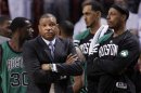 Boston Celtics head coach Doc Rivers, left, and Paul Pierce, right, watch during the final minutes of overtime in Game 2 in their NBA basketball Eastern Conference Finals playoff series against the Miami Heat, Wednesday, May 30, 2012, in Miami. The Heat defeated the Celtics 115-111 in overtime. (AP Photo/Lynne Sladky)