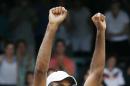 Rajeev Ram celebrates after defeating Ivo Karlovic, of Croatia, in the Tennis Hall of Fame Championship final in Newport, R.I., Sunday, July 19, 2015. (AP Photo/Michael Dwyer)