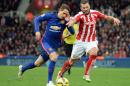 Manchester United midfielder Adnan Januzaj (L) vies for the ball with Stoke City defender Erik Pieters at the Britannia Stadium in Stoke-on-Trent on January 1, 2015