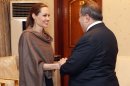 United Nations High Commissioner for Refugees (UNHCR) special envoy Angelina Jolie, left, shakes hands with Iraqi Foreign Minister Hoshyar Zebari in Baghdad, Iraq, Saturday, Sept. 15. Jolie said Friday that with winter approaching, she is concerned about the plight of hundreds of thousands of Syrians forced to flee their homes.(AP Photo/Karim Kadim)