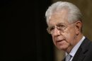 Italy's outgoing Prime Minister Mario Monti talks during a news conference in Rome