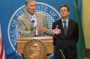 Washington state Gov. Jay Inslee, left, is joined by state Attorney General Bob Ferguson as he talks to the media in Olympia, Wash. about the federal government's announcement that it will not sue to stop Washington and Colorado from taxing and regulating recreational marijuana for adults, on Thursday, Aug. 29, 2013. Last fall, voters made both states the first in the country to legalize the sale of marijuana to adults over 21 at state-licensed stores. The states are creating rules for the system, with sales expected to begin early next year. (AP Photo/Rachel La Corte)