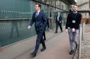 British Chancellor of the Exchequer, George Osborne (L) arrives at the Manchester Central venue on the first day of the annual Conservative party conference on October 4, 2015