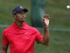 Tiger Woods of the U.S. catches his ball before making a par on the 11th hole during the final round of the Memorial Tournament at Muirfield Village Golf Club in Dublin
