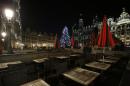 Empty tables are seen at a restaurant on the Grand Place in Brussels, Monday, Nov. 23, 2015. The Belgian capital Brussels has entered its third day of lockdown, with schools and underground transport shut and more than 1,000 security personnel deployed across the country.(AP Photo/Alastair Grant)