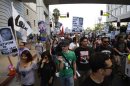 People march during a rally to protest the acquittal of Zimmerman for the killing of Martin, in Los Angeles