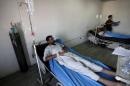 An Iraqi man suffering from cholera waits for medical treatment at a hospital in Baghdad