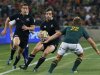 South Africa's Pat Lambie attempts to tackle New Zealand's Conrad Smith during their rugby union test match in Soweto