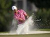 Schwartzel of South Africa hits out of a bunker on the 17th hole during the final round of the DP World Tour Championship at Jumeirah Golf Estates in Dubai