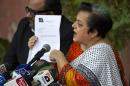 Shireen Mazari, information secretary of the Pakistan Tehreek-e-Insaf party, shows a document during a news conference in Islamabad, Pakistan, Wednesday, Nov. 27, 2013. A political party opposed to U.S. drone attacks in Pakistan revealed what it said was the name of the top CIA spy in the country on Wednesday and called for him and the head of the agency to be tried for a recent missile strike. Pakistani police and intelligence officials have said the attack on an Islamic seminary in Khyber Pakhtunkhwa's Hangu district on Nov. 21 killed five people. (AP Photo/B.K. Bangash)