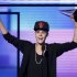 Justin Bieber accepts the award for favorite pop rock album at the 40th American Music Awards in Los Angeles