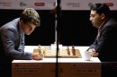 India's Viswanathan Anand, right, plays against Norway's Magnus Carlsen in the Norway Chess 2013 tournament in Sandnes near Stavanger, Norway, Thursday May 9, 2013. (AP Photo/NTB Scanpix, Kent Skibstad) NORWAY OUT