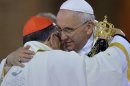 Pope Francis embraces Brazilian Cardinal Raymundo Damasceno after the pontiff received from him the statue of the Virgin of Aparecida from during a Mass inside the Our Lady of Aparecida Basilica in Aparecida, Brazil, Wednesday, July 24, 2013. Francis made an emotional plea Wednesday for Roman Catholics to shun materialism in the first public Mass of his initial international trip as pontiff. Francis is in Brazil for World Youth Day, a church event that brings together young Catholics from around the world roughly every three years. (AP Photo/Luca Zennaro, Pool)