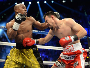 Floyd Mayweather punches Robert Guerrero their WBC welterweight title fight. (USA Today)