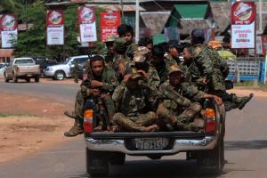 Cambodian soldiers travel along a road about 20 kilometres …