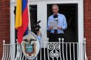 Wikileaks founder Julian Assange addresses the press and his supporters from the balcony of the Ecuadorian Embassy