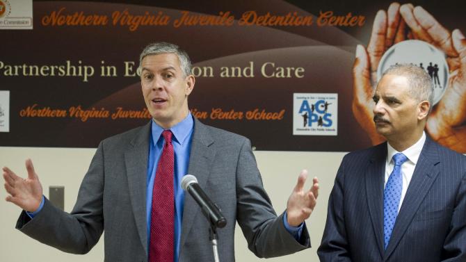 Attorney General Eric Holder listens at right as Education Secretary Arne Duncan speaks with reporters after they toured the Northern Virginia Juvenile Detention Center  in Alexandria, Va., Monday, Dec. 8, 2014. Holder and Duncan used the event to announce guidelines aimed at providing quality educational services for youth in correctional facilities as part of President Barack Obama&#39;s My Brother&#39;s Keeper initiative. (AP Photo/Cliff Owen)