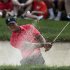 Tiger Woods of the U.S. hits from the sand on the 10th hole during the final round of the Memorial Tournament in Dublin, Ohio