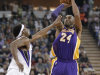 Los Angeles Lakers guard Kobe Bryant, right, shoots over Sacramento Kings forward John Salmons during the first quarter of an NBA basketball game in Sacramento, Calif., Saturday, March 30, 2013. (AP Photo/Rich Pedroncelli)