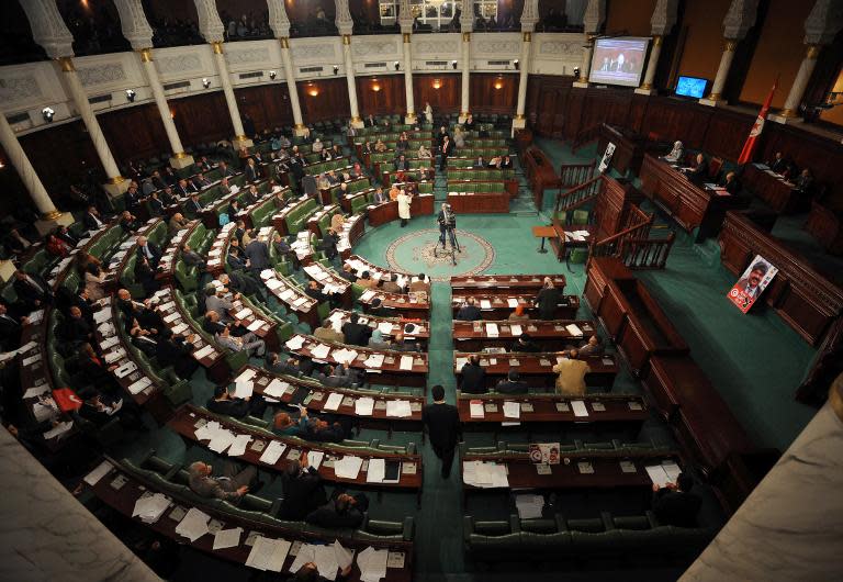 Tunisia gets new constitution and caretaker cabinet