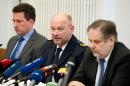 From left: Maik Mainda , special investigator of the Dresden Police, Dresden police chief, Dieter Kroll and prosecutor Erich Wenzlick, attend a press conference in Dresden, eastern Germany, Friday Nov. 29, 2013. A German policeman has been arrested on suspicion of killing and chopping up a man he met on the Internet who apparently fantasized about being killed and eaten. Officials said Friday that the suspect is believed to have fatally stabbed the victim at his home in the eastern state of Saxony on Nov. 4, chopping up the body and burying pieces in his garden. They said the killing happened about a month after the two first met in an Internet chat room. (AP Photo/dpa, Sebastian Kahnert)