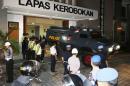 An armored vehicle which is believed to be carrying two Australian death row prisoners Myuran Sukumaran and Andrew Chan, leaves Kerobokan Prison for the airport, in Denpasar