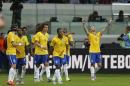 Brazil's Diego Tardelli, right, celebrates after scoring against Mexico during a friendly soccer match in Sao Paulo, Brazil, Sunday, June 7, 2015. Brazil and Mexico are preparing for the Copa America which begins Thursday in Chile. (AP Photo/Andre Penner)