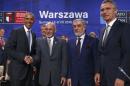 U.S. President Obama shakes hands with Afghanistan's President Ghani next to NATO Secretary General Stoltenberg and Afghanistan's Chief Executive Abdullah Abdullah at the NATO Summit in Warsaw