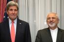 US Secretary of State John Kerry (L) and his Iranian counterpart Mohammad Javad Zarif pose before resuming talks over Iran's nuclear programme in Lausanne on March 16, 2015