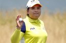 Inbee Park of South Korea acknowledges the crowd on the 9th green at the end of her first round of the 2013 U.S. Women's Open golf championship at the Sebonack Golf Club in Southampton