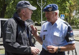 Dutch, right, and Australian policemen talk in the &hellip;