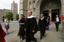 Ben S. Bernanke, Chairman of the Federal Reserve leads the processional out of Princeton University Chapel after giving the Baccalaureate address during an interfaith service in Princeton, N.J. Sunday, June 2, 2013. At left is outgoing Princeton President Dr. Shirley Tilghman, (AP Photo/Rich Schultz)