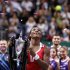 Serena Williams of the U.S. celebrates with the trophy after her victory against Russia's Sharapova after their final WTA tennis championships match in Istanbul