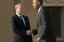 FILE - In this Sept. 5, 2013 pool-file photo, President Barack Obama shakes hands with Russia's President Vladimir Putin during arrivals for the G-20 summit at the Konstantin Palace in St. Petersburg, Russia. 