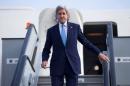 U.S. Secretary of State John Kerry steps off his plane after arriving at Kastrup International Airport in Copenhagen