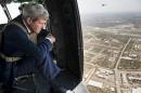 US Secretary of State John Kerry looks out over Baghdad from a helicopter on September 10, 2014