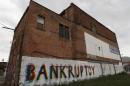File photo of the word "Bankruptcy" is painted on the side of a building in Detroit Michigan