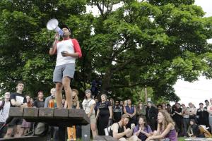 Rafael Ruiz speaks through a megaphone to a crowd gathered &hellip;