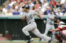 FILE - This July 12, 2014, file photo shows Chicago White Sox's Jose Abreu batting against the Cleveland Indians during a baseball game in Cleveland. Abreu was a unanimous winner of the AL Rookie of the Year award, Monday Nov. 10, 2014. (AP Photo/Mark Duncan, File)