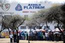 A picture taken on October 5, 2012 shows striking mine workers gathering outside the Anglo American Platinum (Amplats) Mine in Rustenburg