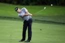 Hunter Mahan hits a fairway shot on the third hole during the final round of play at The Barclays golf tournament Sunday, Aug. 24, 2014, in Paramus, N.J. (AP Photo/Mel Evans)