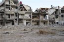 A view of buildings damaged by what activists say is shelling by forces loyal to Syrian President Bashar Al-Assad, in Damascus