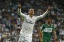 Real's Cristiano Ronaldo celebrates his third goal during a Spanish La Liga soccer match between Real Madrid and Elche at the Santiago Bernabeu stadium in Madrid, Spain, Tuesday, Sept. 23, 2014. (AP Photo/Andres Kudacki)