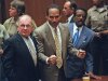 FILE - In this Oct. 3, 1995 file photo, O.J. Simpson, center, reacts as he is found not guilty of murdering his ex-wife Nicole Brown and her friend Ron Goldman, as members of his defense team, F. Lee Bailey, left, and Johnnie Cochran Jr., right, look on, in court in Los Angeles. The return of O.J. Simpson to a Las Vegas courtroom next Monday, May, 13,  will remind Americans of a tragedy that became a national obsession and in the process changed the country's attitude toward the justice system, the media and celebrity. The return of O.J. Simpson to a Las Vegas courtroom next Monday, May, 13,  will remind Americans of a tragedy that became a national obsession and in the process changed the country's attitude toward the justice system, the media and celebrity.(AP Photo/Pool, Myung J. Chun, file)