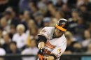 Baltimore Orioles' Chris Davis hits a two-run single against the Seattle Mariners to tie the game in the ninth inning of a baseball game, Tuesday, Sept. 18, 2012, in Seattle. (AP Photo/Ted S. Warren)