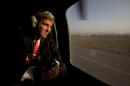 U.S. Secretary of State John Kerry takes off in a black hawk helicopter in Kabul