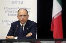 Italy's Prime Minister Enrico Letta listens during a briefing after the EU Eastern Partnership summit in Vilnius