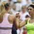 Azarenka of Belarus is congratulated by Sharapova of Russia after their women's semifinals match at the U.S. Open tennis tournament in New York