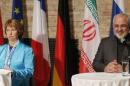 EU foreign policy chief Ashton and Iranian Foreign Minister Mohammad Zarif attend a news conference in Vienna