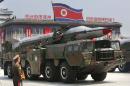A missile is carried by a military vehicle during a parade in Pyongyang